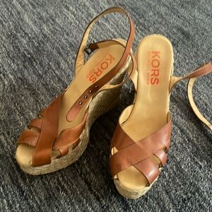 Michael Kors wedges. Wrap around ankle clasp. 5” from bottom to very top of heel